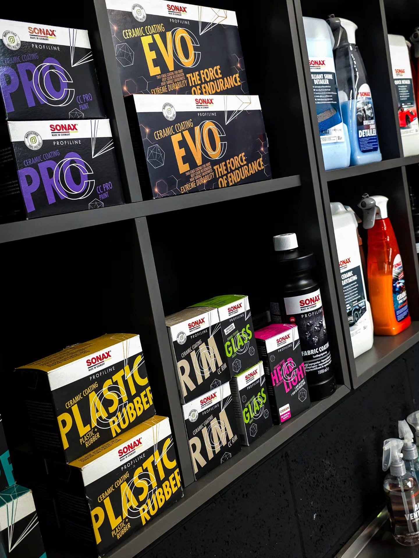 Sonax Profiline ceramic coating range including CC PRO, CC EVO, CC Rim, CC Glass and CC Plastic Rubber on a professional detailing shelf