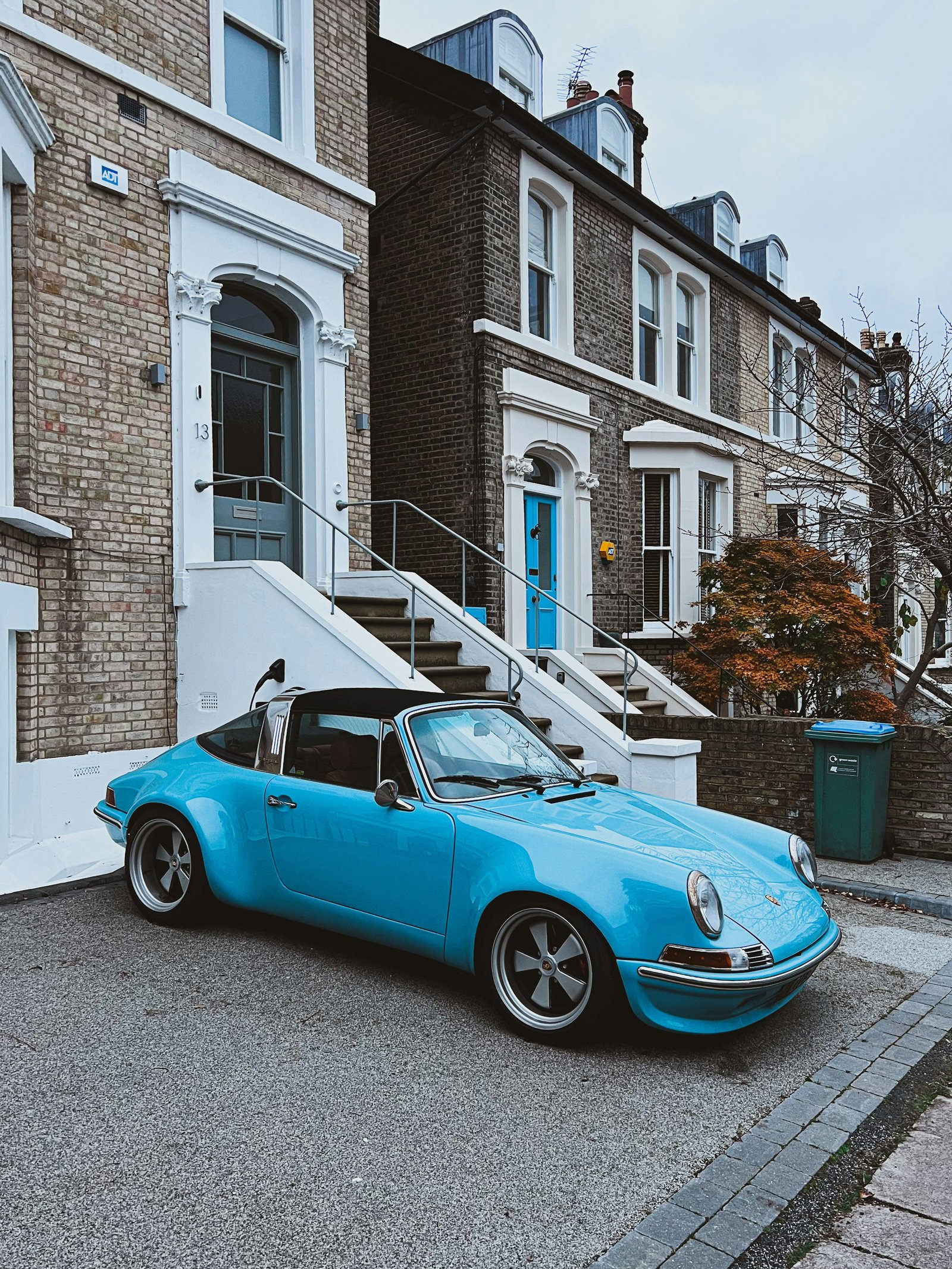 Classic blue Porsche parked outside a residential property in the UK