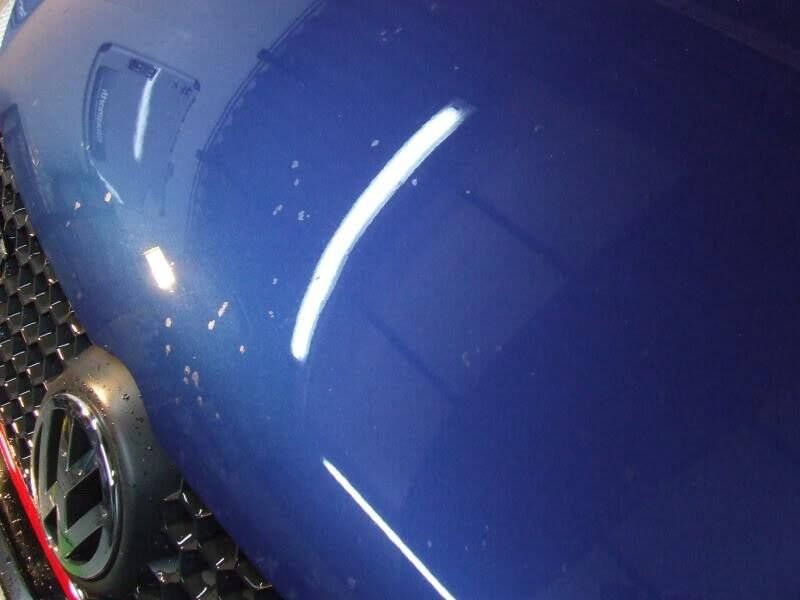 Close-up of stone chip on car bonnet