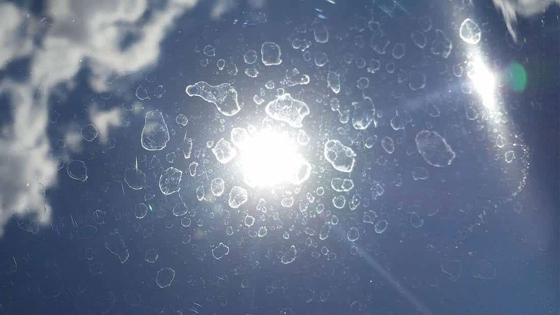 Water spot etching on dark car paint