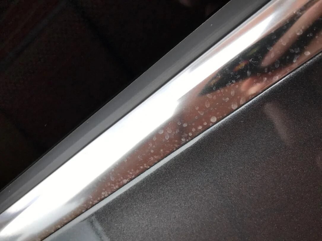 Tarnished dull chrome trim on car