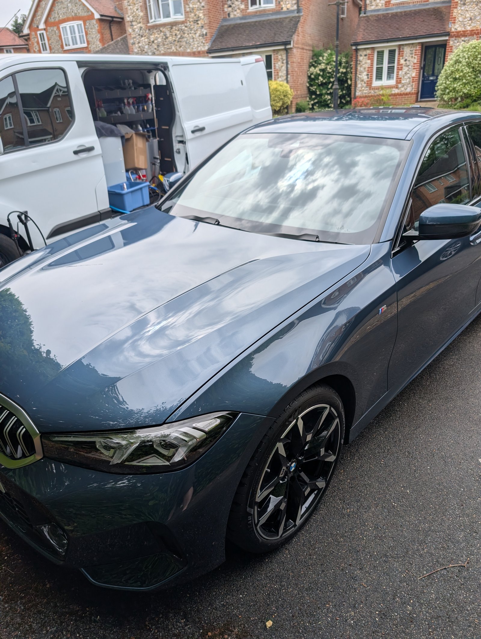 Finished BMW 3 Series with glossy paintwork after a mobile valet on a residential driveway