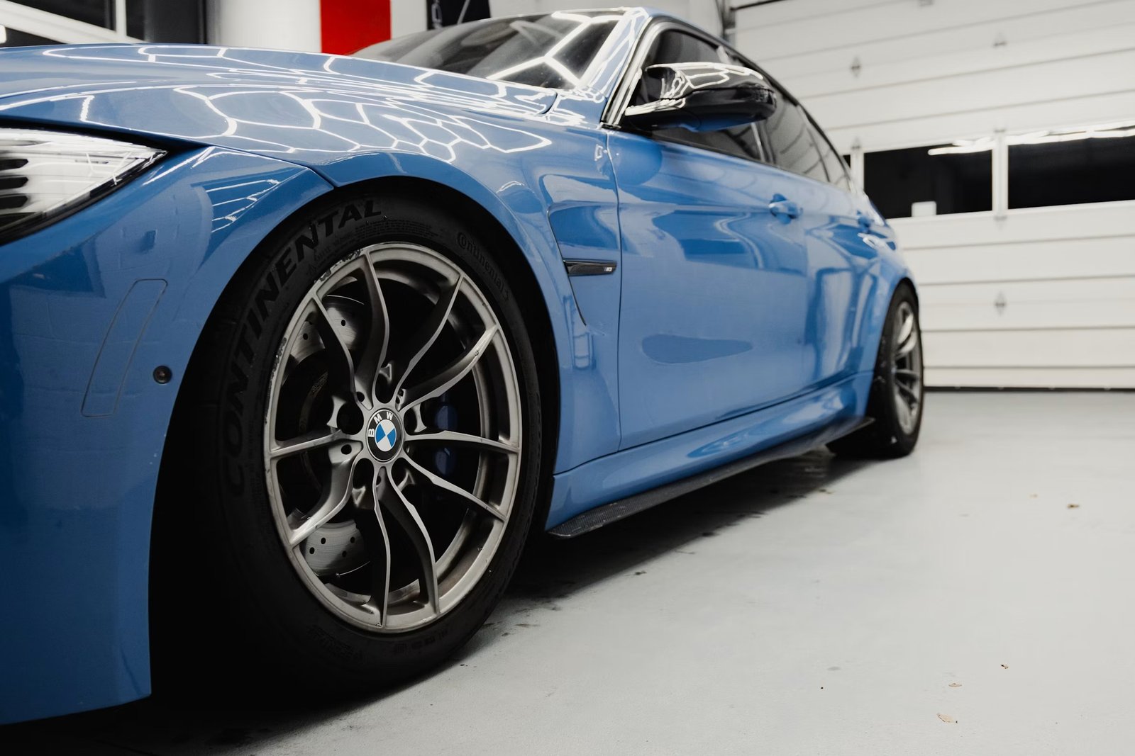 Glossy, mirror-like car paint finish after professional paint correction