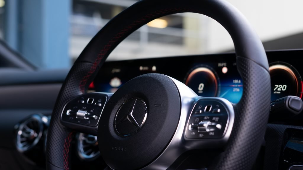 Greasy steering wheel with worn grip areas