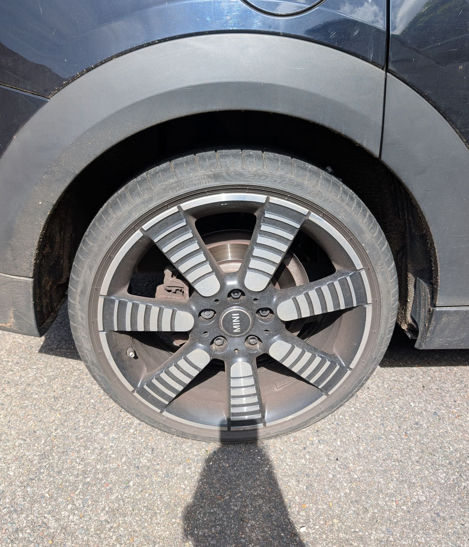 MINI alloy wheel before cleaning, covered in brake dust and grime