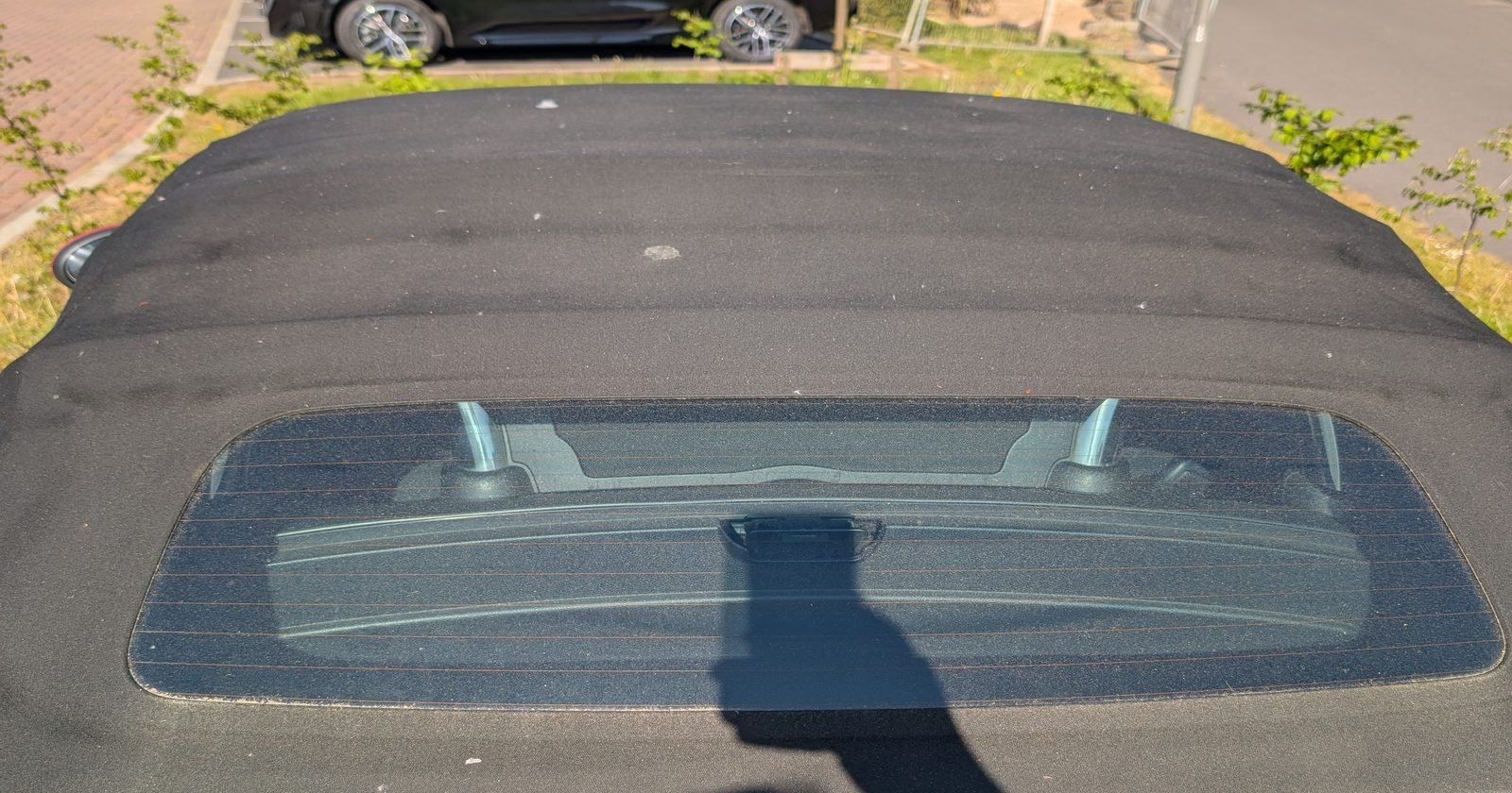 Convertible soft top before cleaning, covered in dust and debris