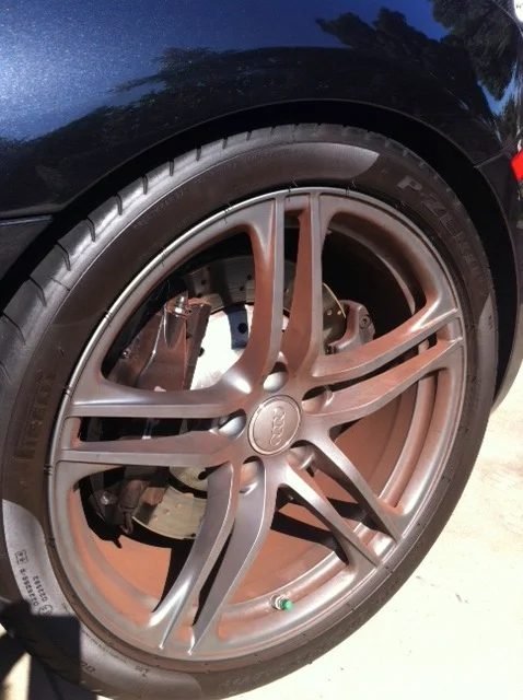 Alloy wheel covered in dark brake dust
