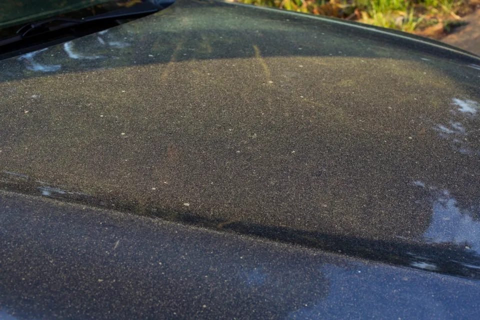 Yellow pollen film on car bonnet