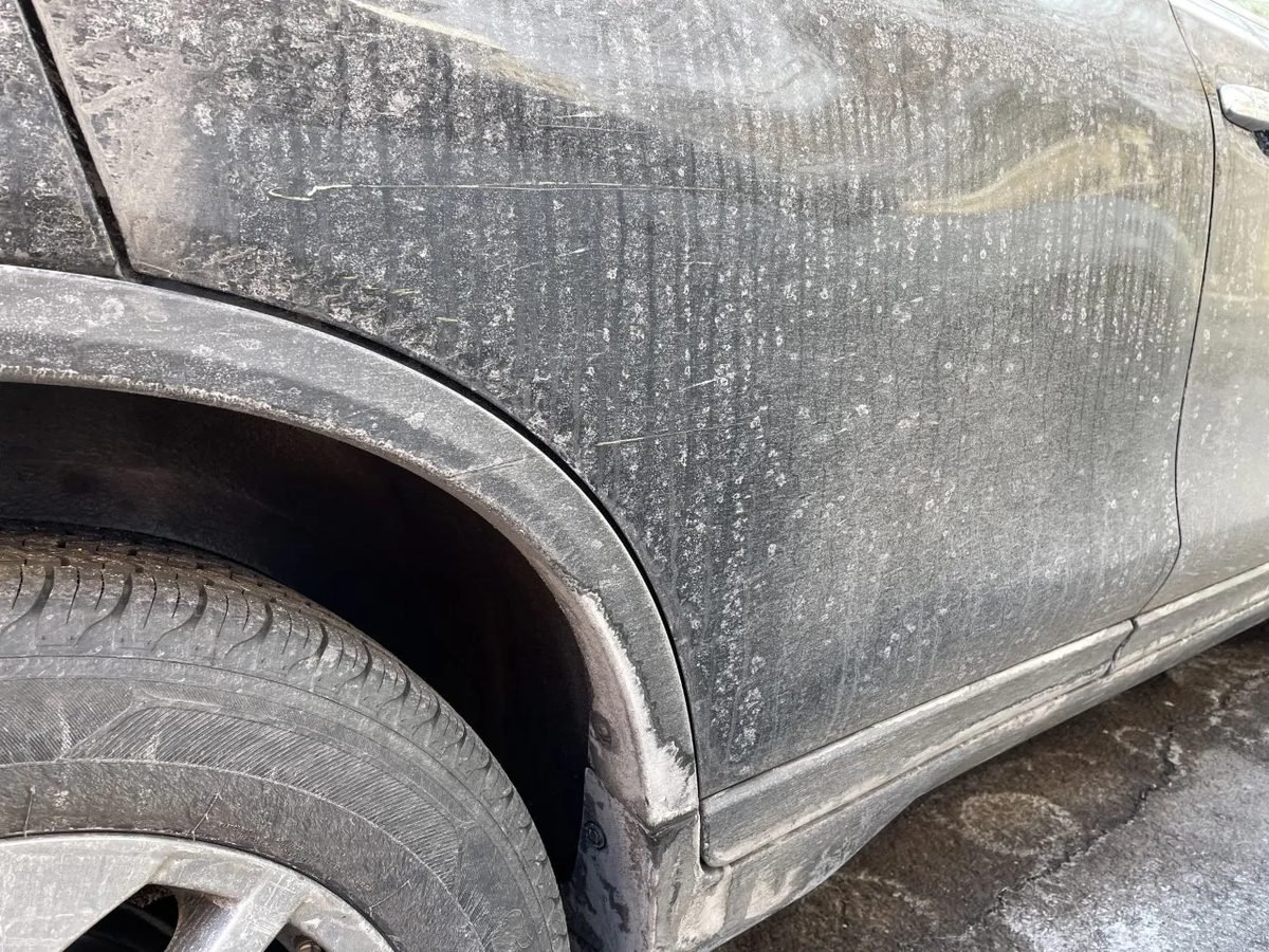 White road salt residue on lower car panels