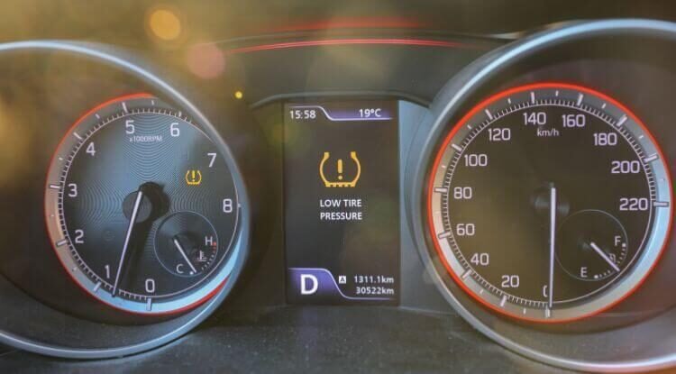 Car tyre visibly underinflated and low