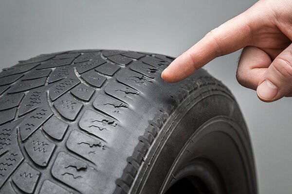 Uneven tyre wear pattern on used tyre
